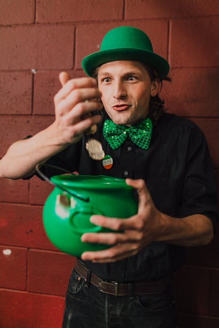 將吸引力法則視為魔術 A joyful man with a green hat and bow tie holding a pot of gold on St. Patrick's Day.